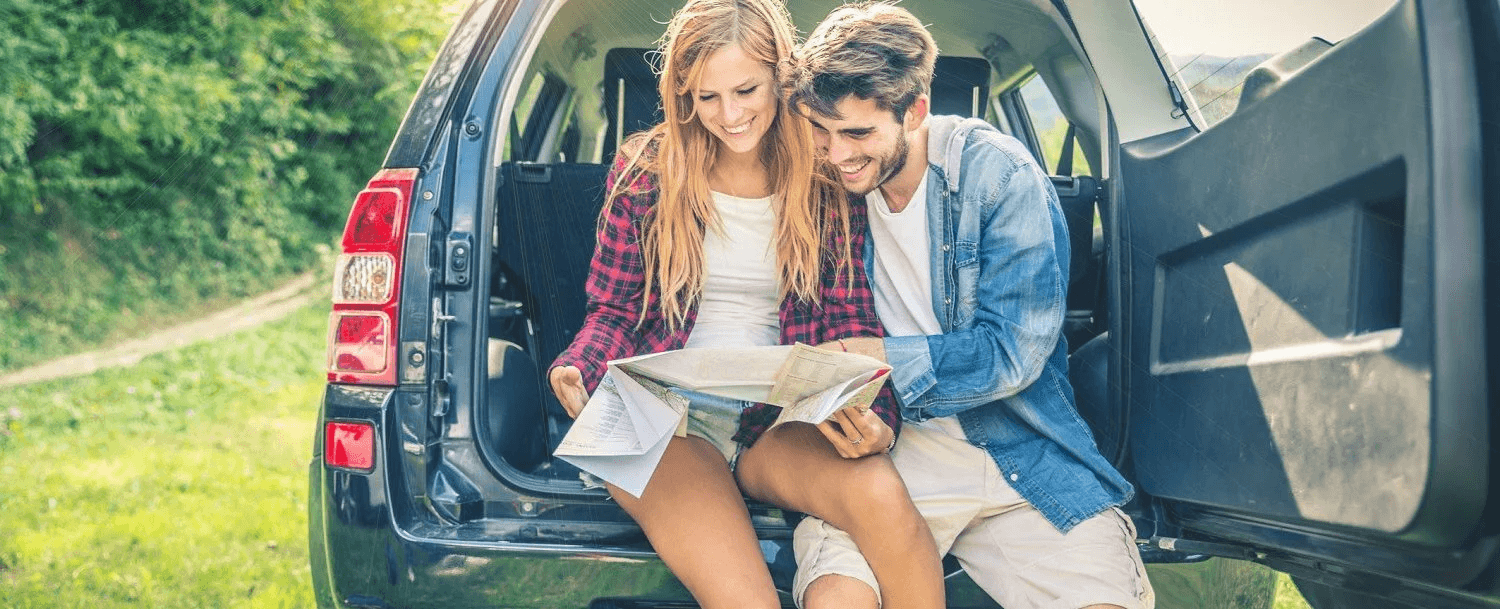 Couple looking at map while on vacation.