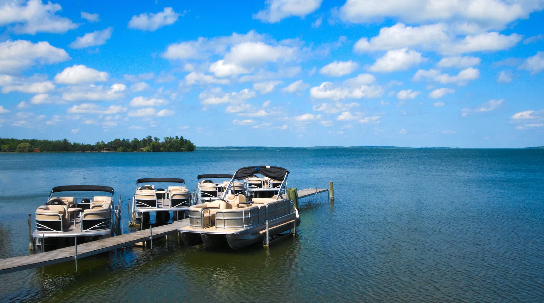 pontoon boats on a lake